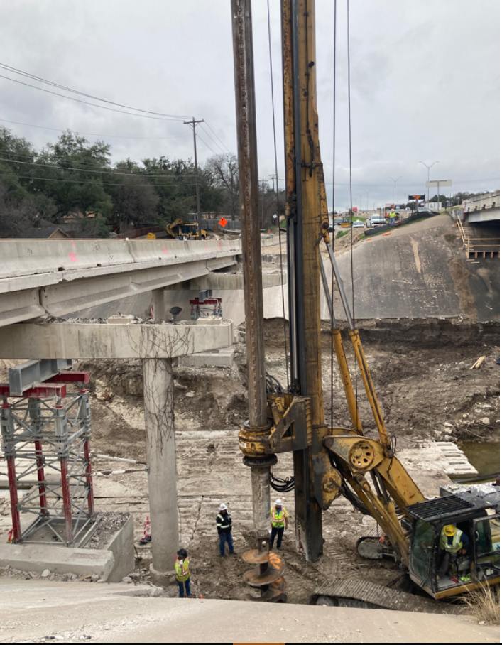 Northbound I-35 frontage road at Walnut Creek bridge construction - February 2024
